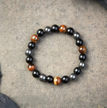 Load image into Gallery viewer, Buddha Padmasana Triple Protection Bracelet - Tiger’s Eye, Obsidian, Hematite Buddha padmasana