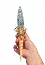 Load image into Gallery viewer, Hand-forged Ocean Tide Witch Dagger displayed against a clean white background, showcasing a clear quartz blade and a fossilized ammonite handle.